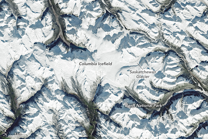 The Visible Infrared Imaging Radiometer Suite (VIIRS) on the NOAA-20 satellite acquired this image during the widespread “unusually pleasant” weather on October 31, 2021. Snowcapped peaks are visible across numerous ranges and subranges, from the Coast Mountains in British Columbia to the Rockies in western Alberta.