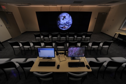 The NASA Center for Climate Simulation (NCCS) Data Exploration Theater features a 17- by 6-foot multi-screen visualization wall for engaging visitors and scientists with high-definition movies of simulation results. Here, the wall displays a 3.5-kilometer-resolution global simulation that captures numerous cloud types at groundbreaking fidelity.

Credit: NASA/Pat Izzo