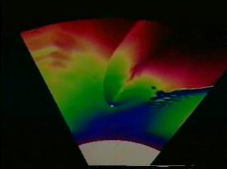 A simulation of the wake of a high luminosity neutron star in orbit around a massive star