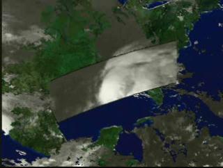 A fly-in to Hurricane Earl on September 2, 1998, showing the three-dimensional structure of the precipitation as measured by the Precipitation Radar instrument on TRMM.  In this animation, a surface of constant precipitation is colored by the value of the precipitation on the ground under the surface.  The global cloud cover data was measured by GOES.