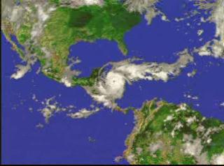 A fly-in to Hurricane Mitch on October 27, 1998, showing the three-dimensional structure of the precipitation as measured by the Precipitation Radar instrument on TRMM.  In this animation, a surface of constant precipitation colored by the value of the precipitation on the ground under the surface is revealed, then a second surface of higher precipitation is revealed.  The global cloud cover data was measured by GOES.