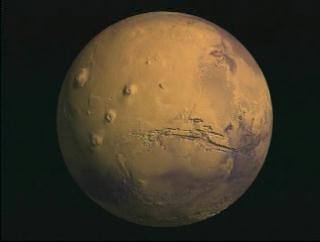 Flyover of Valles Marineris on Mars topography globe with true color texture