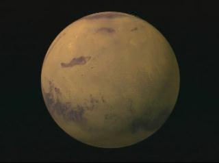 Rotating a Martian globe, using Viking imagery, to the south pole and fading to topography data from MOLA, showing that large portions of the ice cap may be covered by dust.  Note that the permanent frozen cap of carbon dioxide ice is not located directly at the south pole.  White colors indicate elevations in excess of 3012 meters, and dark violet shows elevations from 320 to  2150 meters.