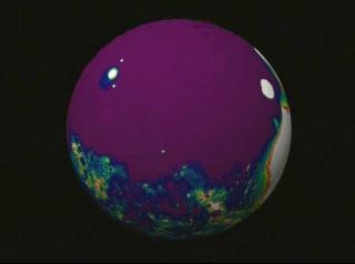 A rotating view of the Martian south pole using MOLA topography data.  This animation uses a color table designed to highlight the topography at the south pole.  White colors indicate elevations in excess of 3012 meters, red shows elevations between 2500 and 3012 meters, yellow shows elevations from 2450 to 2500 meters, dark cyan shows elevations from 2150 to 2450 meters, dark violet shows elevations from 320 to 2150 meters.