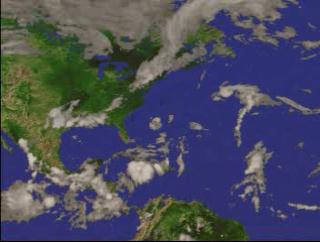 A fly-in to Hurricane Florence on September 13, 2000, showing the three-dimensional structure of the precipitation as measured by the Precipitation Radar instrument on TRMM.  In this animation, a surface of constant precipitation is colored by the value of the precipitation on the ground under the surface.  The global cloud cover data was measured by GOES.