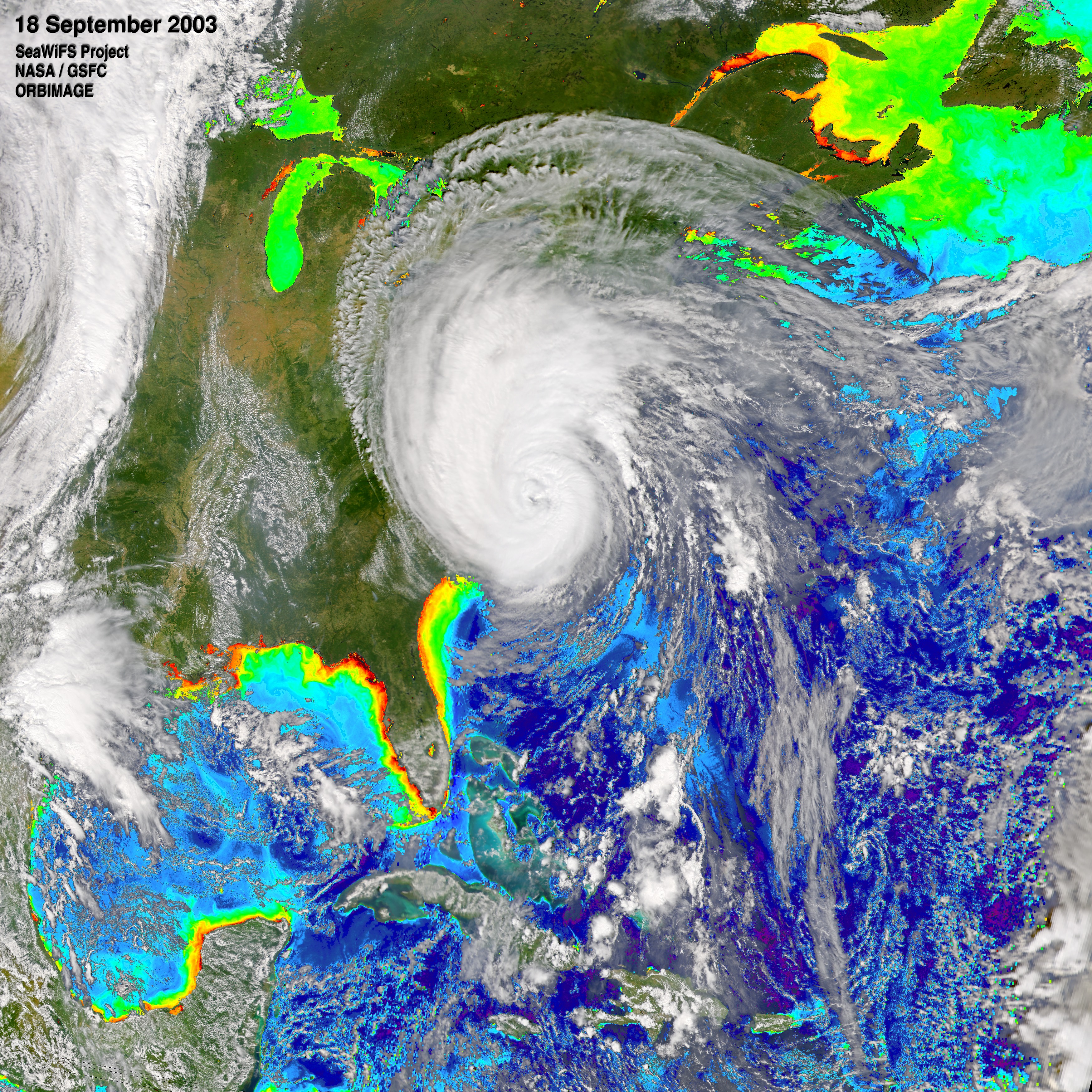 Print resolution still of SeaWiFS data on 9-18-03.  Note the light blue trail southeast of the hurricane.  This trail indicates higher levels of phytoplankton near the ocean surface.