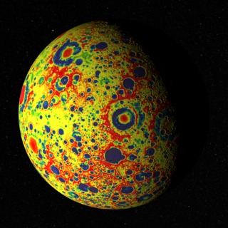 The GRAIL free-air gravity map of the Moon, rendered on the Moon's surface as it floats in front of a starry backdrop (the constellation Hydra). About 75% of the visible disk is illuminated from the left, lighting longitudes roughly between 75° and 180° east. The view is centered on Mare Moscoviense, a feature on the far side.