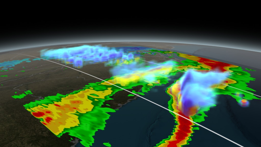 Visualization of GPM collecting data on March 17th, 2014 over the last major snow storm of winter 2013-2014 to hit the east coast. The animation begins with GPM/GMI collecting a swath of ground rain rate data across the region of interest. A volumetric dataset of rain rates (taken by DPR) then dissolves in to show the structure of the storm. A dissecting plane is then turned on to not only provide relative height and width information for the storm, but it then slices through the storm to reveal some of the storm's interior structure. Shades of green to red indicate areas of liquid precipitation. Shades of cyan to purple are areas of frozen precipitation. GPM is the first satellite to differentiate between liquid and frozen precipitation.