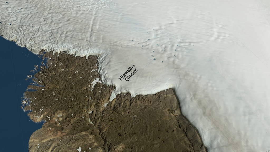 Starting from a global view, this visualization zooms into Inglefield Land in northwest Greenland and shows the location of Hiawatha Glacier. The surface of the ice sheet is then faded away to show the impact crater beneath the ice sheet. A red cylinder shows the best-fit rim of the impact crater and a measuring stick shows the diameter as more than 31 kilometers across. The size of the crater is compared to the cities of Washington, DC and Paris, France.This video is also available on our YouTube channel.