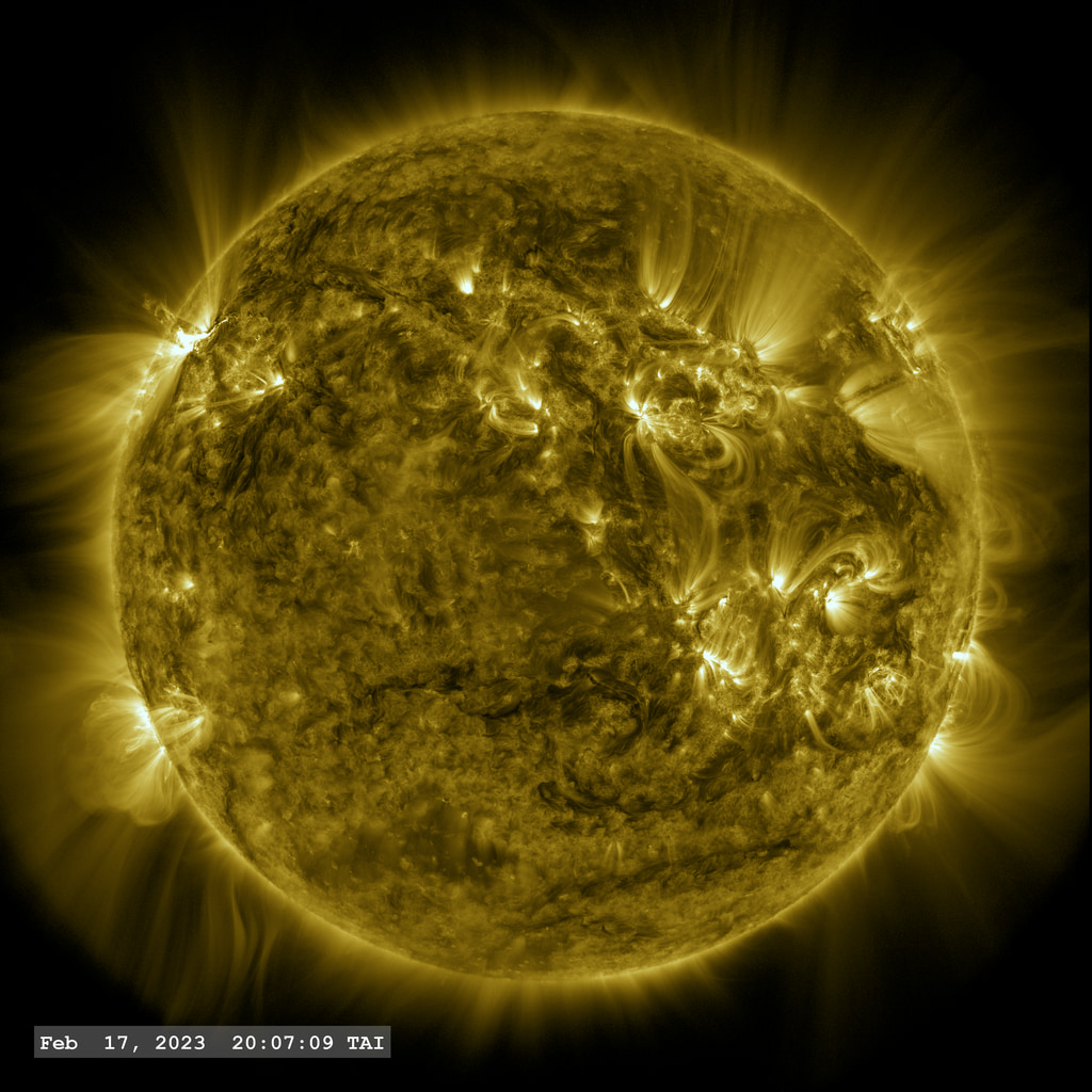 Active Region 13229 (upper left limb of solar disk) fires off an X2.2 flare in this view from SDO/AIA filter 171 angstroms.  The point-spread function correction (PSF) has been applied to all this imagery.