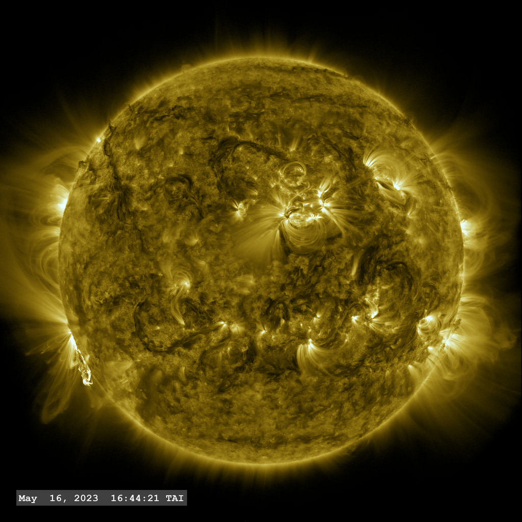 An M 9.6 class flare erupts from the lower left limb of the Sun from Active Region 13310 followed by a bright filament.  This is a view through the 171 angstrom filter on the SDO AIA instrument.