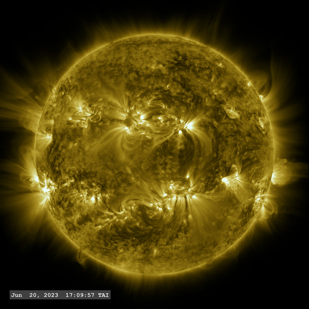 Active region AR 13341 launches an X1.1 class solar flare (lower left) in this view from SDO/AIA in the 171 angstrom filter.