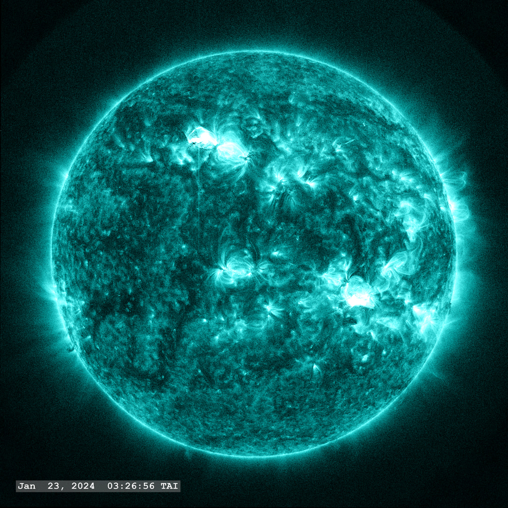 Two small flares, within minutes of each other (upper left and lower right), erupt in this view from the SDO/AIA 131 angstrom filter.