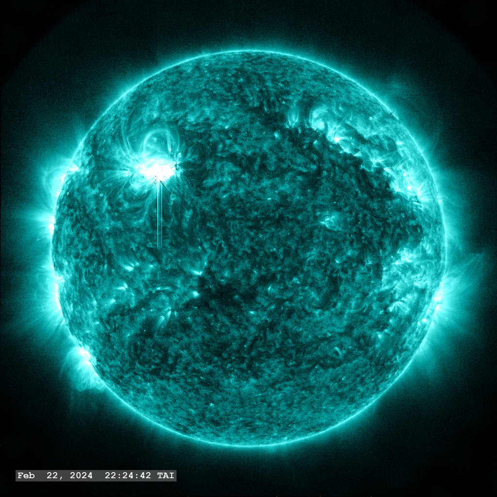 An X 6.3 flare erupts from Active Region 13590 in the upper left quadrant of the image in this view from SDO/AIA 131 angstrom filter. The point-spread function correction (PSF) has been applied to all this imagery.