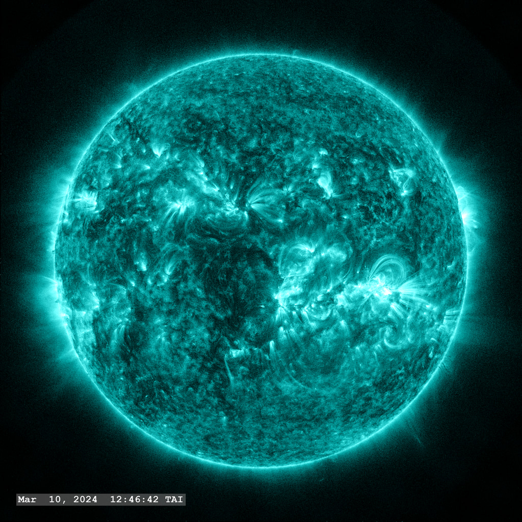 An M7.4 flare erupts from Active Region 13599 in the lower right quadrant of the image in this view from SDO/AIA 131 angstrom filter. The point-spread function correction (PSF) has been applied to all this imagery.