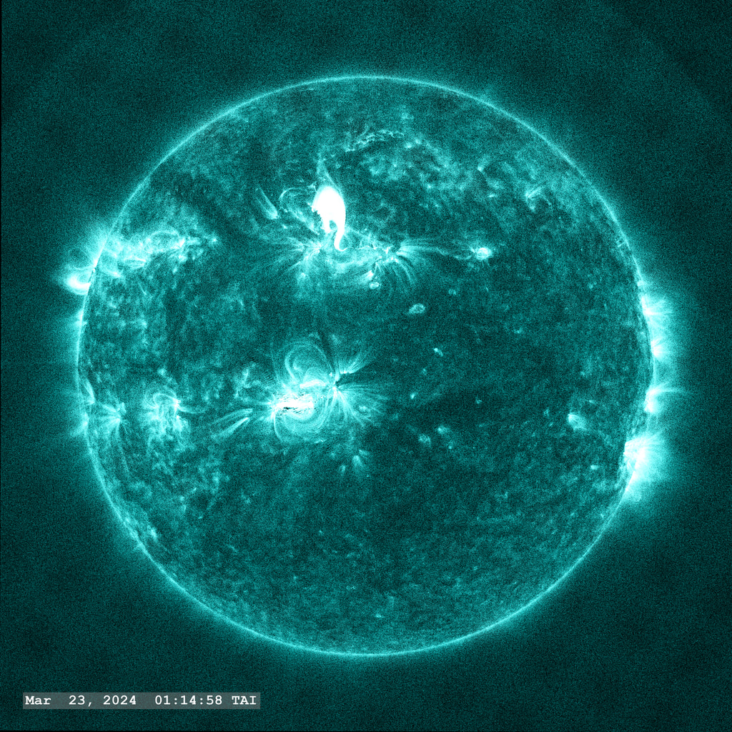 Active Regions 13614 (upper) and 13615 (lower) near the center of the solar disk, appear to launch dual solar flares with an equivalent class of X1.1 in this view through the SDO/AIA 131 angstrom filter.