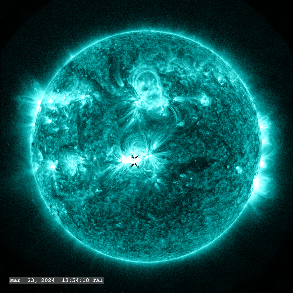 An M5.3 flare erupts from Active Region 13615 near the center of the solar disk in this view from SDO/AIA 131 angstrom filter. The point-spread function correction (PSF) has been applied to all this imagery.