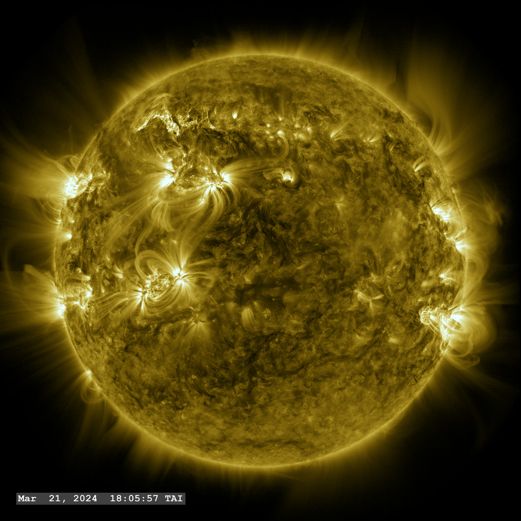 Two plasma filaments are launched from Active Region 13614 (upper left) in this view from SDO with the AIA 171 Angstrom filter.