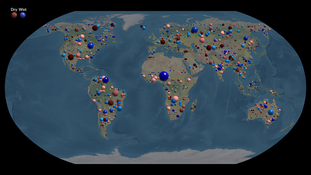 This visualization shows extremes of the water cycle — droughts and pluvials — over a twenty-year period (2002-2023) based on observations from the GRACE and GRACE-FO satellites. Dry events are shown as red spheres and wet events as blue spheres, with earlier years being shown as lighter shades and later years as darker shades. The volume of the sphere is proportional to the intensity of the event, a quantity measured in cubic kilometer months. A total of 1,138 extreme wet and dry events are shown the visualization. The plots at the bottom of the figure show that the total intensity of extreme events increased as global temperatures increased. 