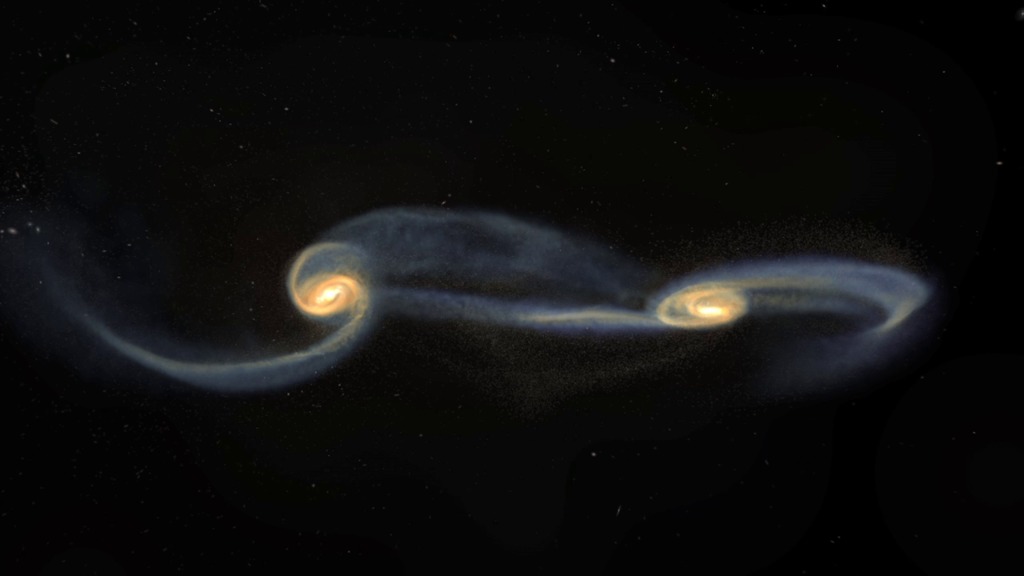 This visualization shows two colliding galaxies that merge into a single elliptical galaxy over a period spanning two billion years.  Credits:  NCSA, NASA, B. Robertson, L. Hernquist