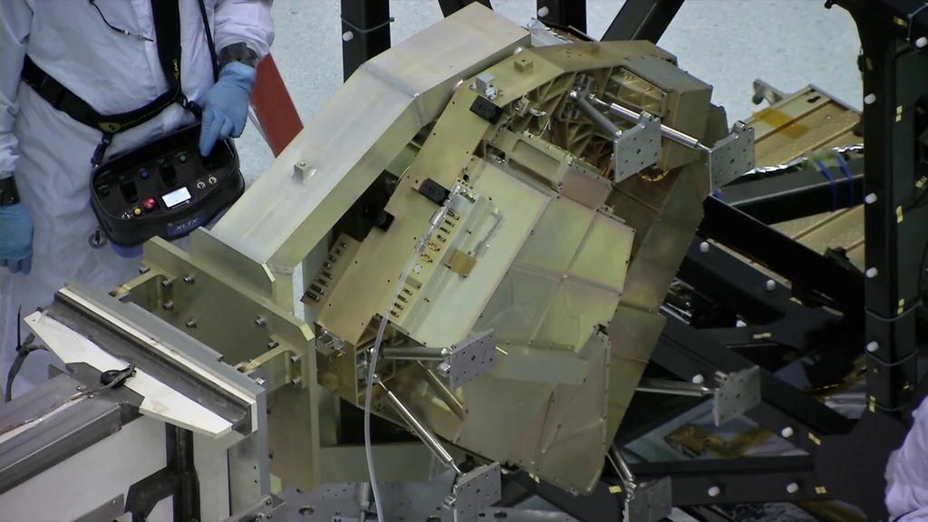 Vide b-roll of engineers at NASA Goddard Space Flight Center removing Webb's FGS/NIRISS instrument from the ISIM.  