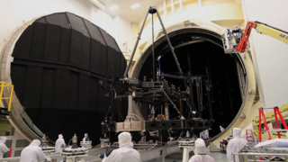 Engineers move the Webb Telescope’s Backplane Pathfinder (a flight-like model of the center section of the Webb telescope backplane used to practice assembly and integration before the flight hardware is done) into the huge vacuum and cryogenic test chamber at the NASA Johnson Space Center called Chamber A.  This operation tests the facility, procedures and materials in preparation for testing Webb’s flight Backplane.