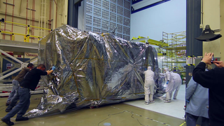 Engineers lift the James Webb Space Telescope's cameras and spectrographs out of the Space Environment Simulator at NASA's Goddard Space Flight Center in Greenbelt, Maryland. These vital parts of the Webb Space Telescope endured their last super-cold test at NASA Goddard before installation into the telescope.