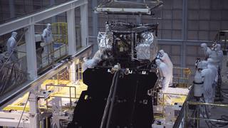 Raw video of two dozen engineers and technicians successfully installed the package of science instruments of the James Webb Space Telescope into the telescope structure. The package, known as the Integrated Science Instrument Module or ISIM, is the collection of cameras, spectrographs and fine guidance systems that help record the light collected by Webb’s giant golden mirror.

Inside the world’s largest clean room at NASA’s Goddard Space Flight Center in Greenbelt, Maryland, the team crane-lifted the heavy science instrument package, lowered it into an enclosure on the back of the telescope, and secured it to the telescope.