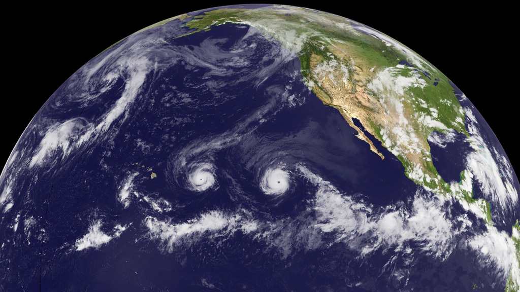 NASA tracks two storms churning in the Pacific Ocean.