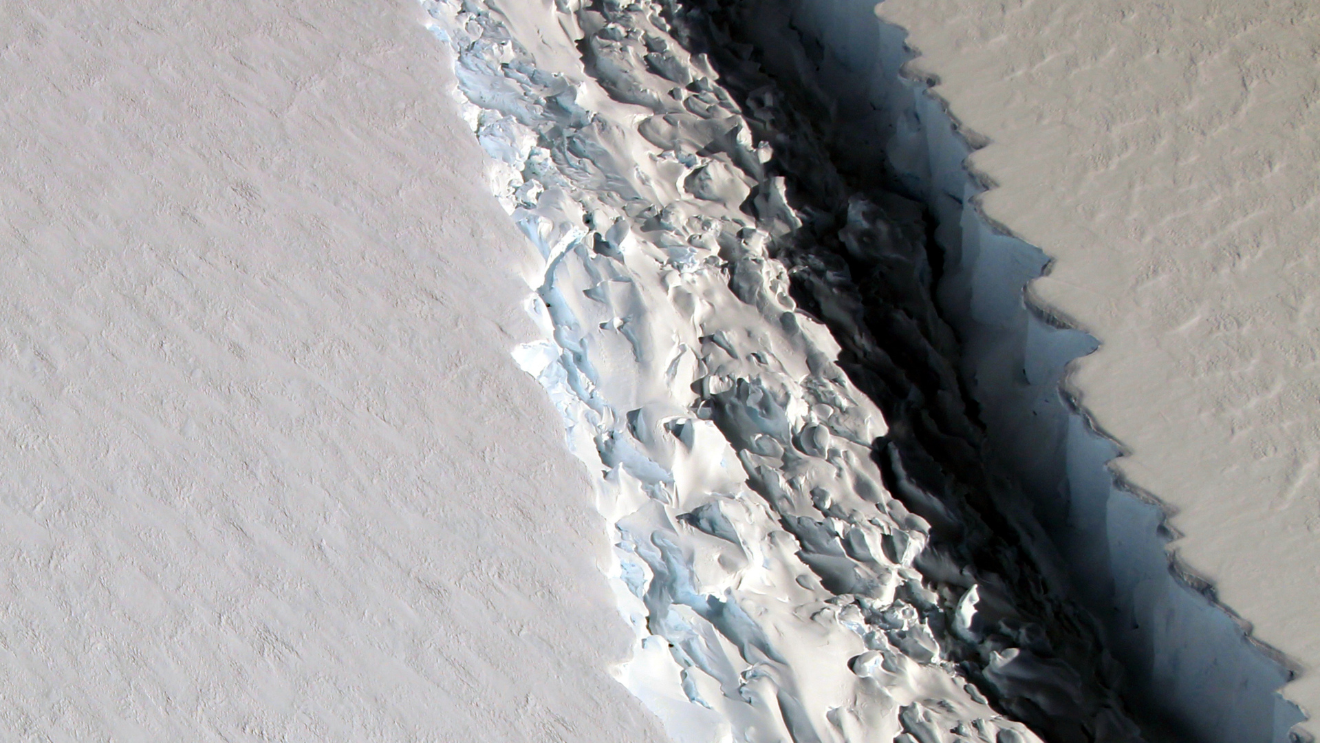 As of Nov., 2016, the rift in Larsen C was about 300 feet wide and about a third of a mile deep. 