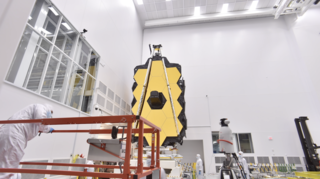 Carried inside a U.S. Air Force C5M Super Galaxy aricraft, the James Webb Space Telescope arrives at Ellington Field Reserve Joint Base near Houston, Texas on May 5, 2017.  The Webb Telescope team unloads the telescope and transports it by road to the NASA Johnson Space Center for cryogenic testing.  During its transport from the NASA Goddard Space Flight Center to the NASA Johnson Space Center, the Webb Telescope is kept safe inside the Space Telescope Transport Air Rail and Sea (STTARS) container.  

At the NASA Johnson Space Center, engineers cleaned and moved STTARS into the Chamber A cleanroom where the Webb Telescope was unloaded and attached to a rollover fixture.