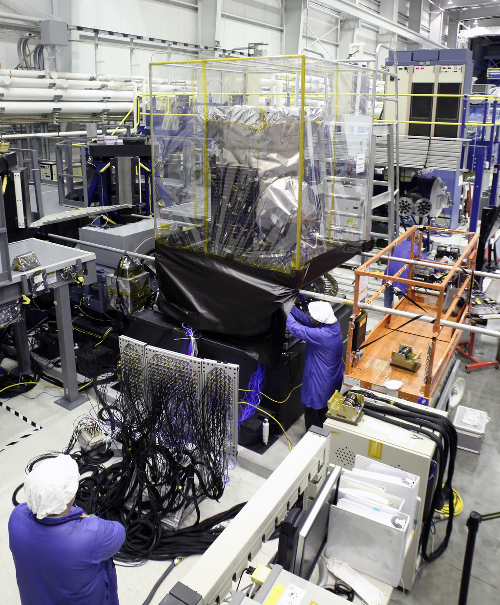 Photo of TESS spacecraft being tested on vibration table at Orbital ATK in Dulles, Va.