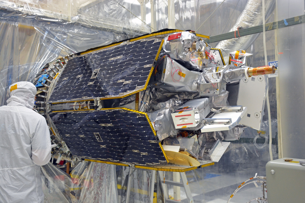 Orbital ATK engineer inspects the ICON to Pegasus XL interface after the satellite has been mated to the Launch Vehicle.Credit: NASA/Randy Beaudoin