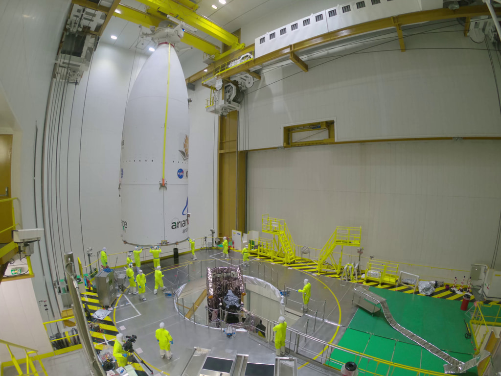 Captured with a GoPro - Timelapse from the upper level of the rocket fairing being lowered over the Webb Telescope.