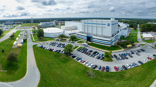 Building 29, home of the largest high-bay clean room in the world, stands prominently in this panoramic aerial view of NASA's Goddard Space Flight Center in Greenbelt, Maryland. The clean room is as tall as an eight-story building and as wide as two basketball courts. The circular structure left of center houses the High Capacity Centrifuge, which is used to simulate launch and landing loads on spacecraft hardware. Imaged Oct. 5, 2023, looking south-southwest.Credit: NASA/Francis Reddy