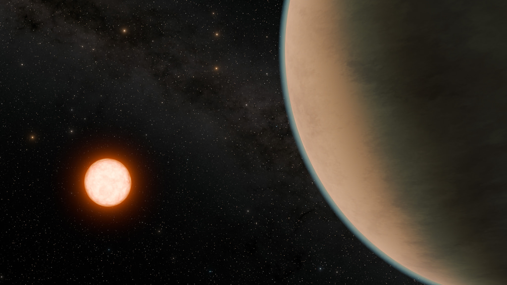 Gliese 12 b, which orbits a cool, red dwarf star located just 40 light-years away, promises to tell astronomers more about how planets close to their stars retain or lose their atmospheres. In this artist’s concept, Gliese 12 b is shown with a thick atmosphere similar to that of Venus in our solar system.Credit: NASA/JPL-Caltech/R. Hurt (Caltech-IPAC)Alt text: Space scene of a Venus-like version of Gliese 12 bImage description: Against a starry background, a bright, reddish star shines at lower left. At right, the body of a planet dominates the view, its hazy limb arcing from top center to bottom right. A thick, yellow-brown atmosphere obscures any view of its surface. 