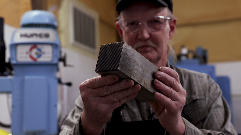 This video shows Richard Koenecke, an engineer at NASA’s Goddard Space Flight Center, creating the body of one of the NICER (Neutron star Interior Composition Explorer) patches.0:00 Two blocks of aluminum sit on a counter in front of a laptop that displays the schematics for the NICER patches. 0:06 Koenecke puts one block on the bed of a saw littered with metal shavings and then trims the block. 0:23 Koenecke sands down the block’s rough edges. 0:30 Koenecke walks into another part of his workshop. 0:37 Koenecke preps the machining chamber. 0:49 Inside the chamber, the machine starts to carve out the shape of the patch. Fluid sprayed from the nozzles above the tool helps cool the metal. 0:56 Koenecke looks into the chamber. 0:59 The chamber is shown at different angles. 1:15 Koenecke walking up to the chamber window. 1:22 Inside the chamber, the patch’s shape is now visible amidst a sea of aluminum shavings. 1:25 The cutting tool refines the shape of the patch. 1:40 Koenecke looks at a computer readout for the machining chamber. 1:45 Inside the chamber, the cutting tool lowers to hollow out the patch. 1:56 Koenecke holds and turns a block of the aluminum. 2:45 Koenecke’s dog Sara guards his shop on the Eastern Shore. 2:53 Koenecke sands a block of aluminum. 3:01 He closes the doors to the machining chamber and adjusts the settings on a computer screen. 3:10 Numbers change on the chamber’s computer screen. 3:31 Koenecke holds and turns the fully machined patch body. 3:51 In slow motion, Koenecke walking through his shop. 4:25 In slow motion, Koenecke holds the patch in close-up shots.Credit: NASA/Sophia Roberts and Scott Wiessinger