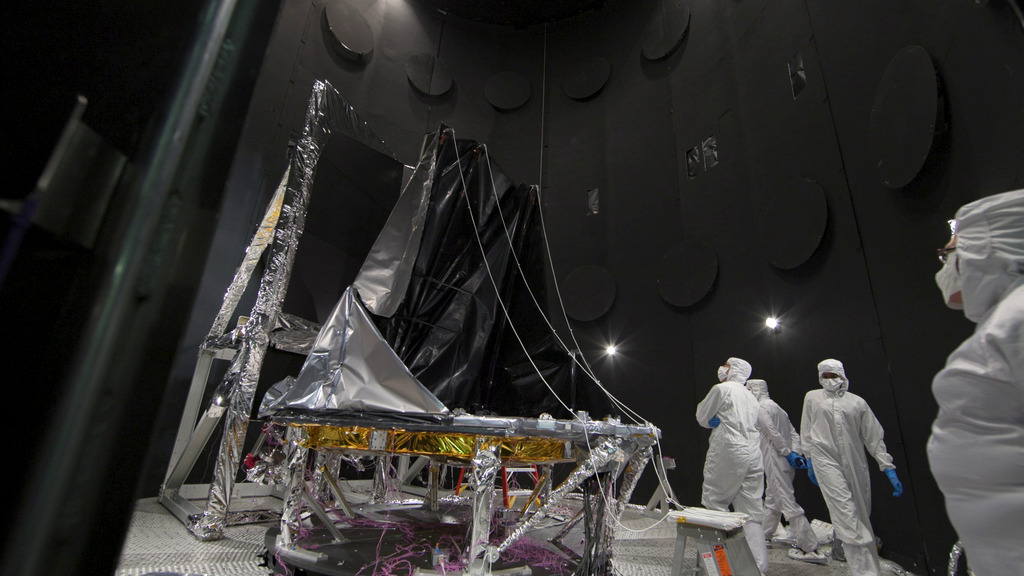 Footage on a slider of the unfolding Deployable Aperture Cover inside NASA Goddard's Space Environment Simulator. 